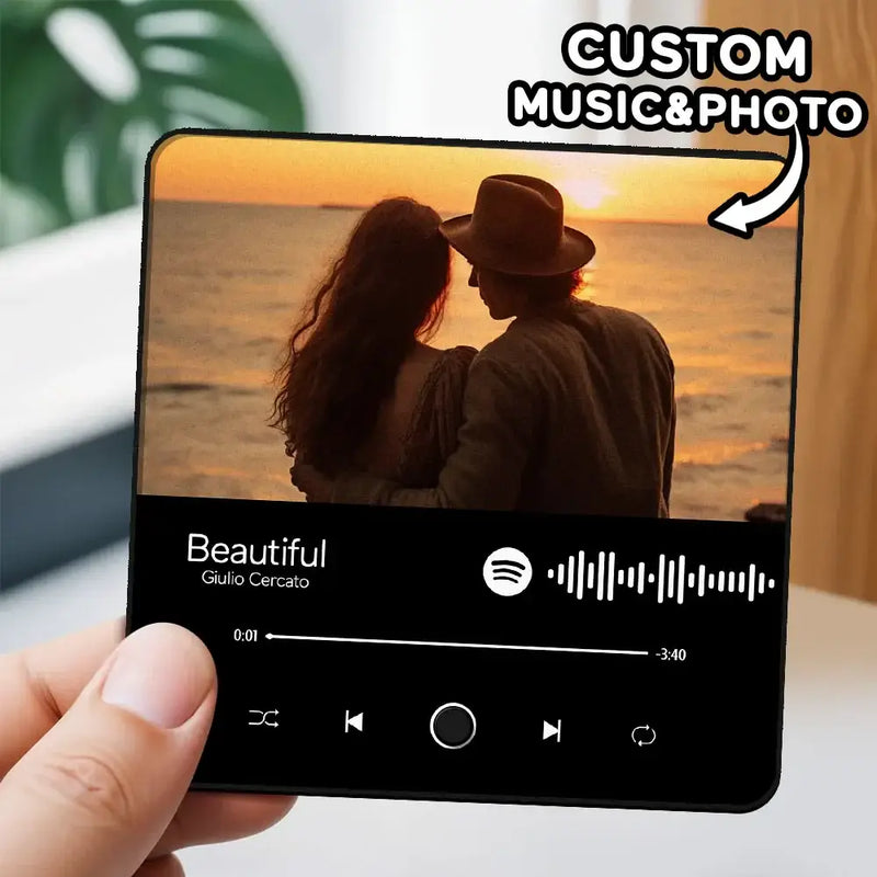 Custom music fridge magnet with photo of a couple enjoying a sunset, featuring Spotify interface.