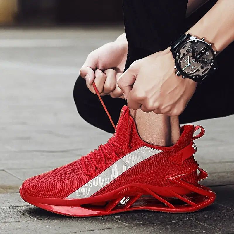 Men's red breathable sneakers with stylish design, perfect for casual wear and running.