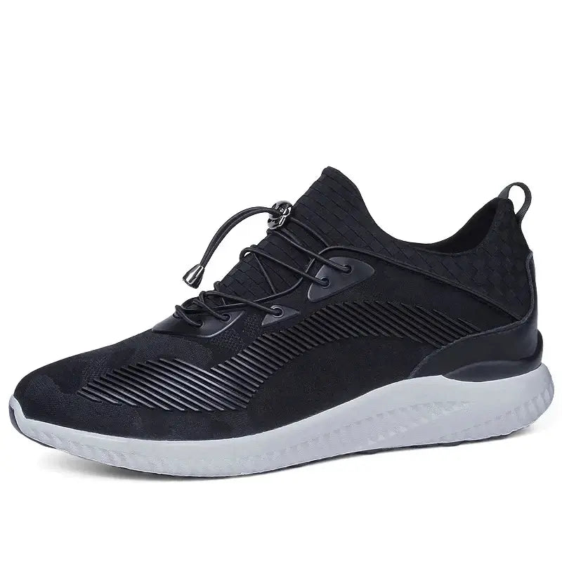 Breathable black elevator sneakers for men with height increasing insole and elastic closure.