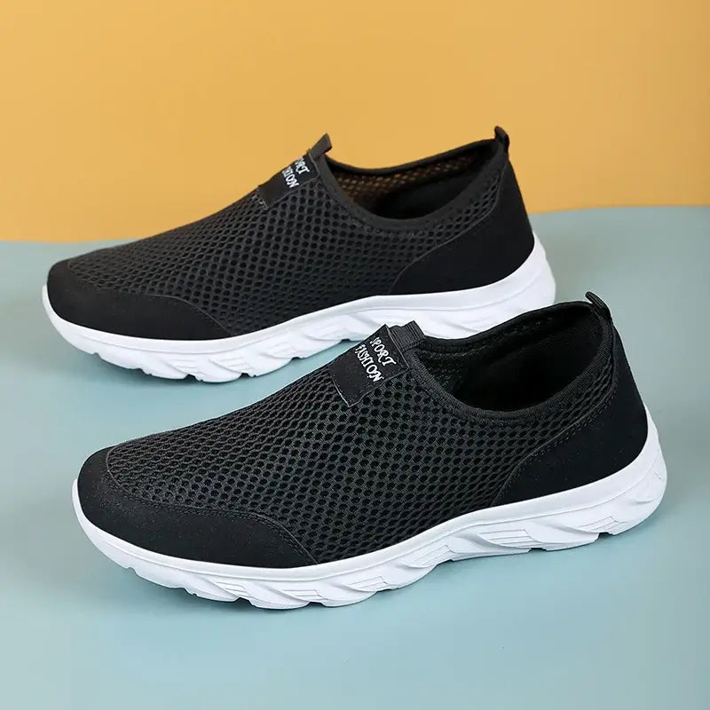 Black mesh breathable sneakers for men, slip-on style with non-slip sole, perfect for summer outdoor activities.