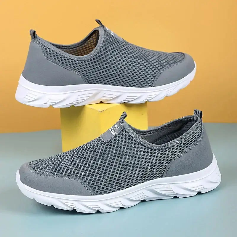 Men's grey mesh slip-on sneakers, breathable, lightweight, anti-odor, outdoor casual shoes for summer.