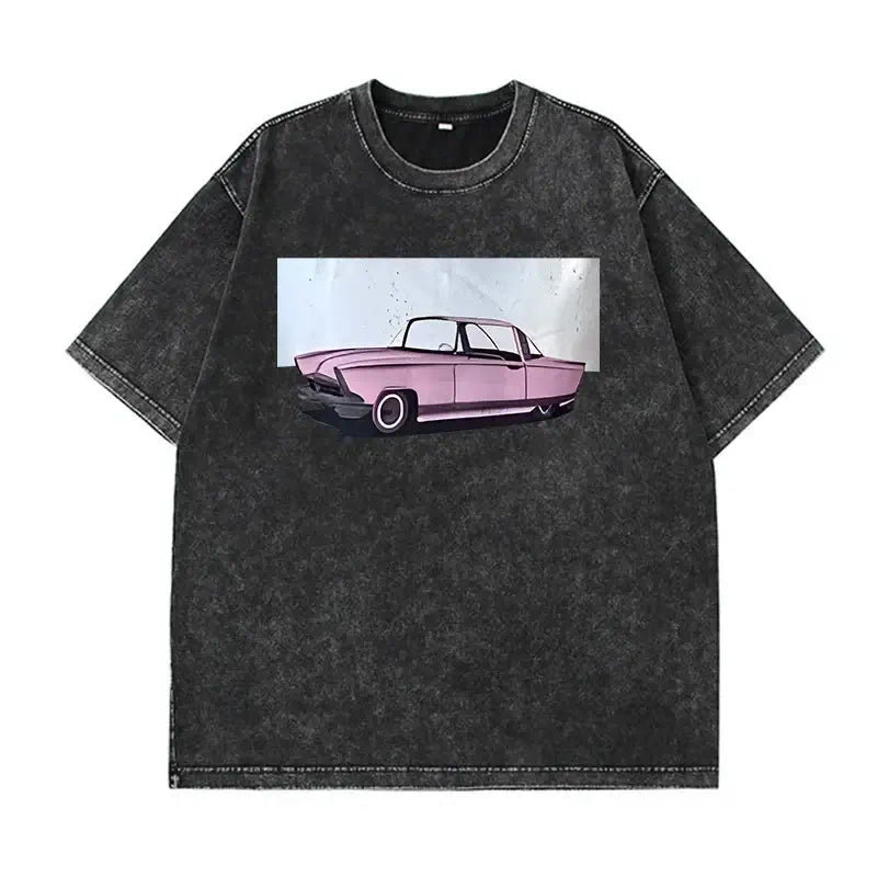 Oversized black washed T-shirt featuring a vintage pink car graphic design on the front.