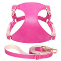 Pink PU leather dog harness and leash set for small pets, adjustable and soft material for comfort.