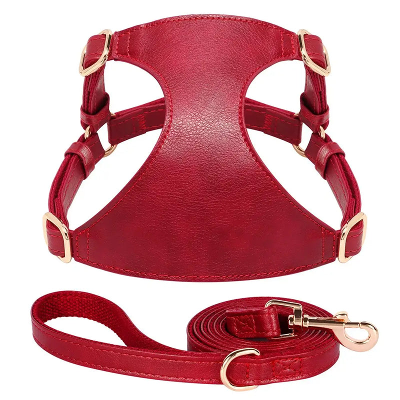 Red PU leather dog harness with leash set, adjustable vest for small to medium pets in solid design.