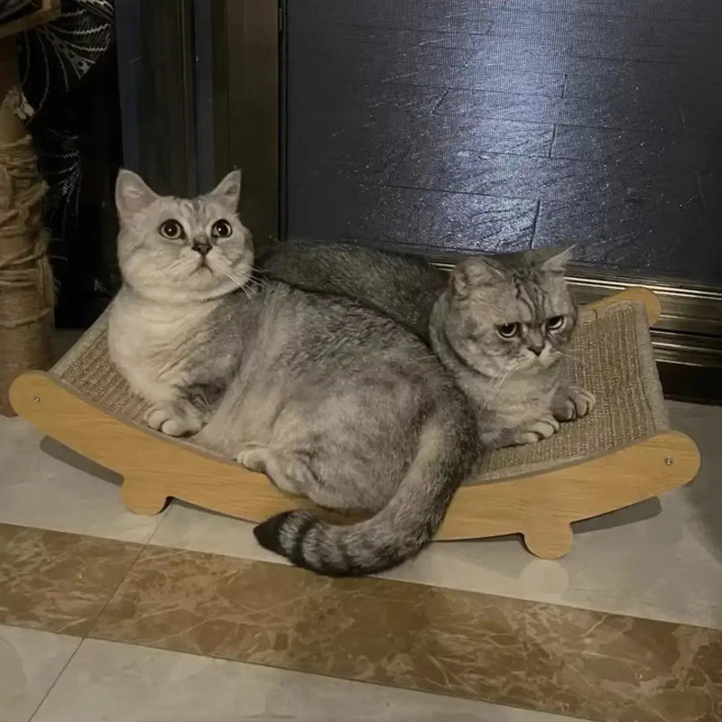 Two cats lounging on a cozy sisal scratching board, enjoying their comfortable spot together.