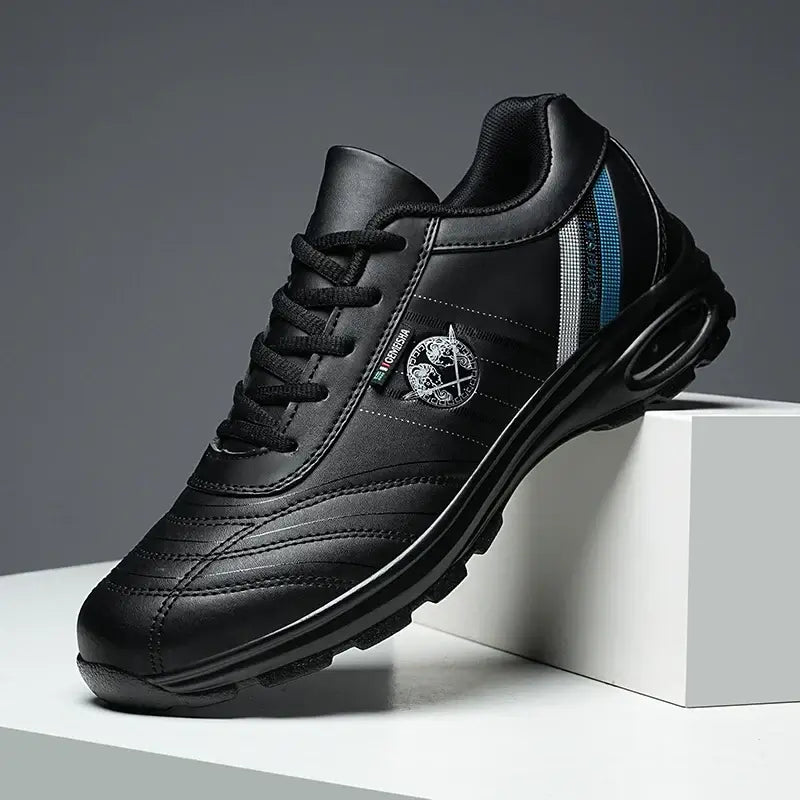 Men's black casual sneakers with mesh accents, breathable, lace-up design, ideal for summer wear and stylish comfort.