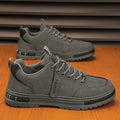 Stylish grey lightweight men's shoes with breathable soft sole for running and outdoor activities.