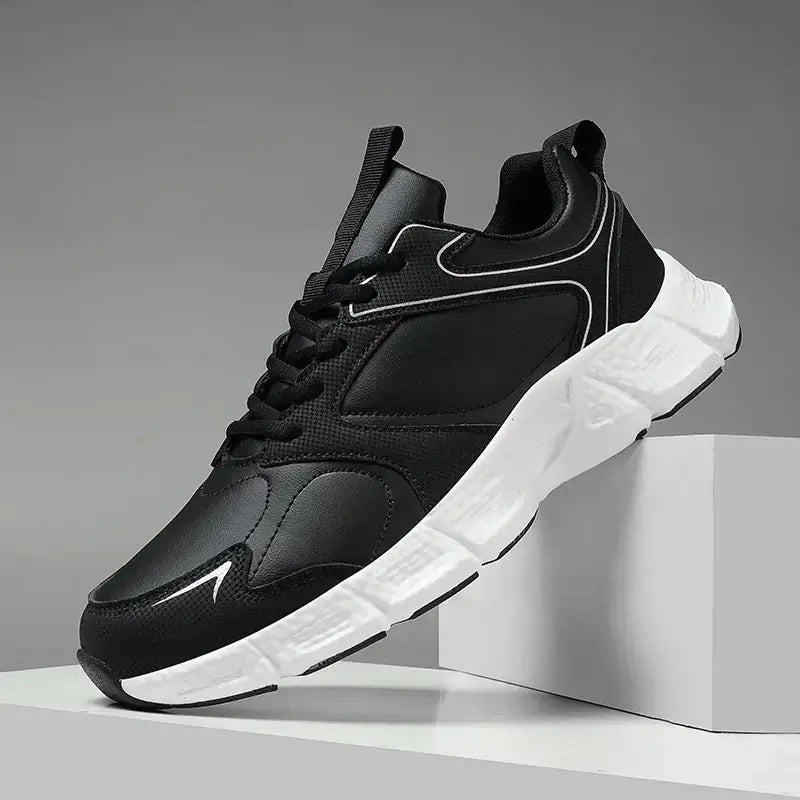 Men's black casual sneakers with white sole, breathable mesh upper, perfect for summer running and fashion.