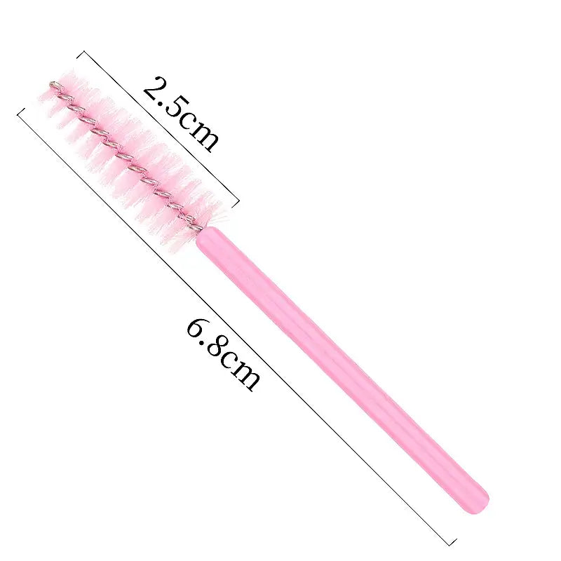 Pink disposable mini eyelash brush measuring 6.8cm, ideal for makeup application and lash extension.