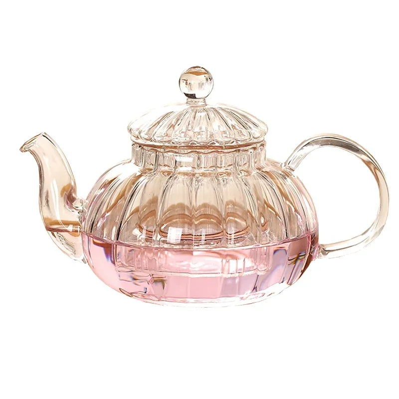 600ml striped pumpkin-shaped glass teapot with lid, featuring a clear body and pink liquid inside, ideal for herbal tea.