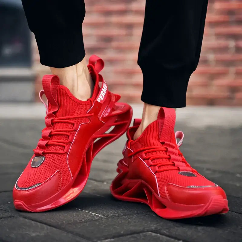 Men's breathable red sneakers with a stylish design, perfect for casual running and outdoor fashion.