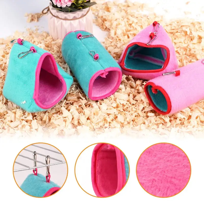 Colorful plush pet hamster nests in pink and blue, perfect for small pets and birds. Cozy and warm with clips for hanging.