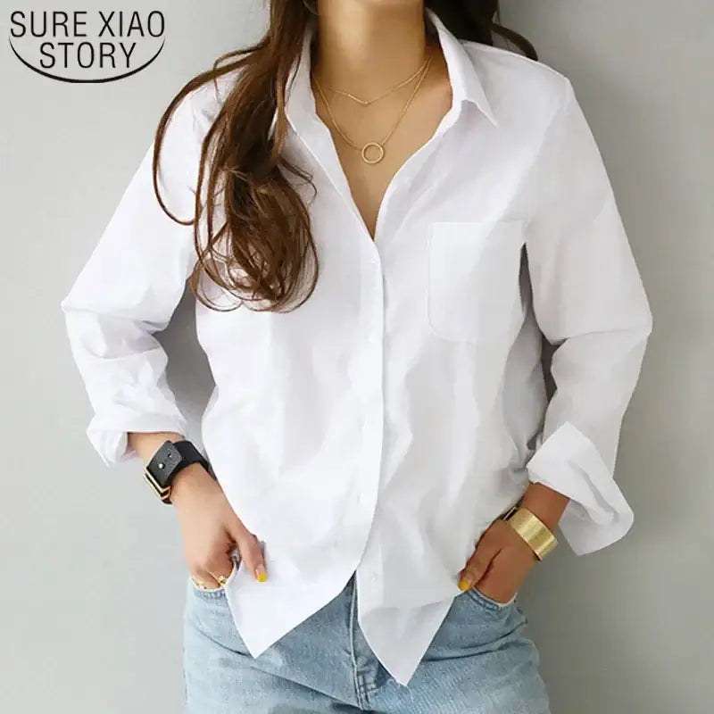 Elegant white blouse for women with turn-down collar and long sleeves, perfect for casual office style.