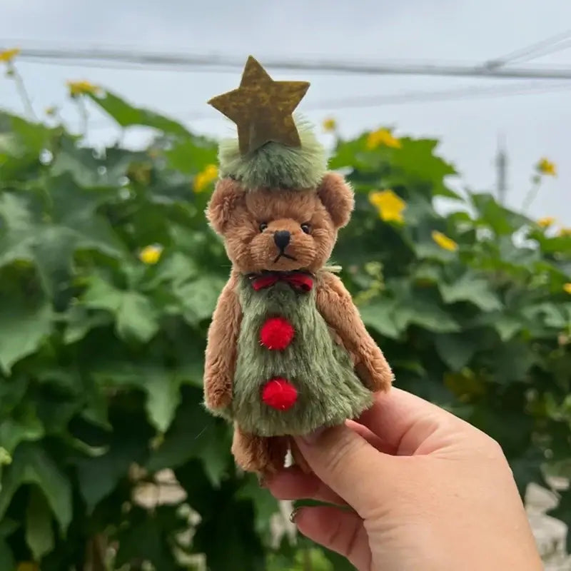 Cute Christmas bear stuffed animal with a star and festive colors, perfect for holiday decor and gifting.