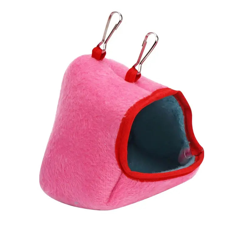 Pink plush hamster nest cave with clips, cozy winter accessory for small pets and birds.