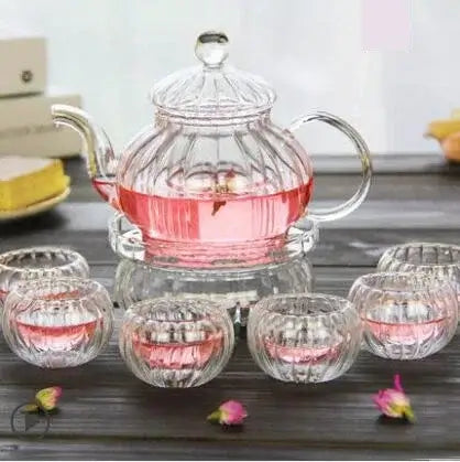 600ml striped pumpkin-shaped glass teapot with infuser and flower tea cups, displaying pink herbal tea.