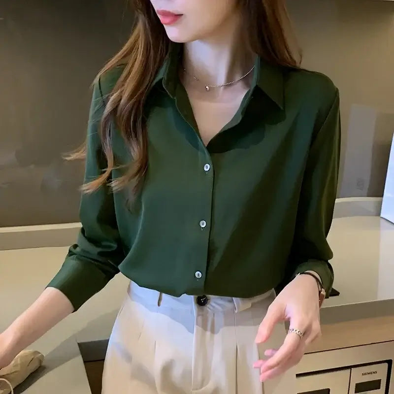 Green long sleeve blouse for women, stylish office wear with single breasted button closure.