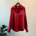 Elegant red satin long sleeve shirt with collar and button closure, perfect for casual wear in all seasons.