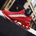 Red breathable men's sneakers with a stylish design and mixed color pattern, perfect for casual and running activities.