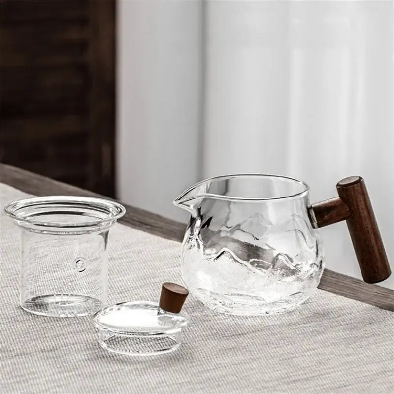 450ml heat-resistant glass teapot with infuser and wooden handle, perfect for brewing flower tea.