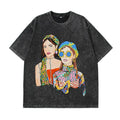 Oversized black T-shirt featuring colorful graphic of two women in trendy fashion styles.