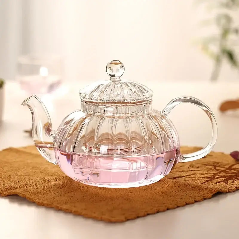 600ml striped pumpkin shape glass teapot with infuser and pink herbal tea, heat resistant borosilicate glass.