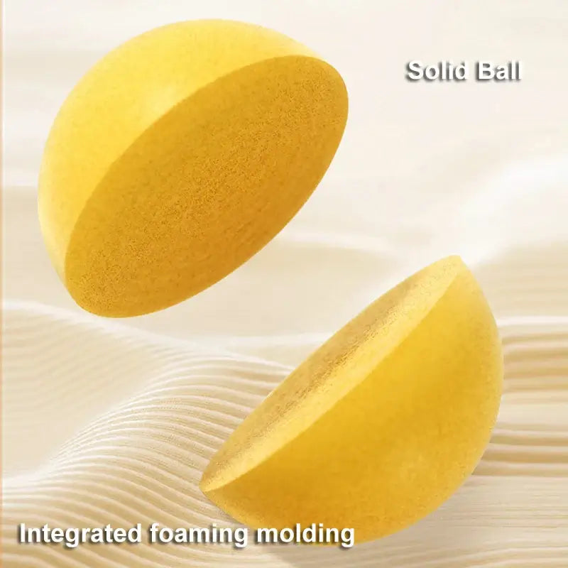 Close-up of a solid yellow mute ball showcasing integrated foaming molding, ideal for silent play and kids' games.