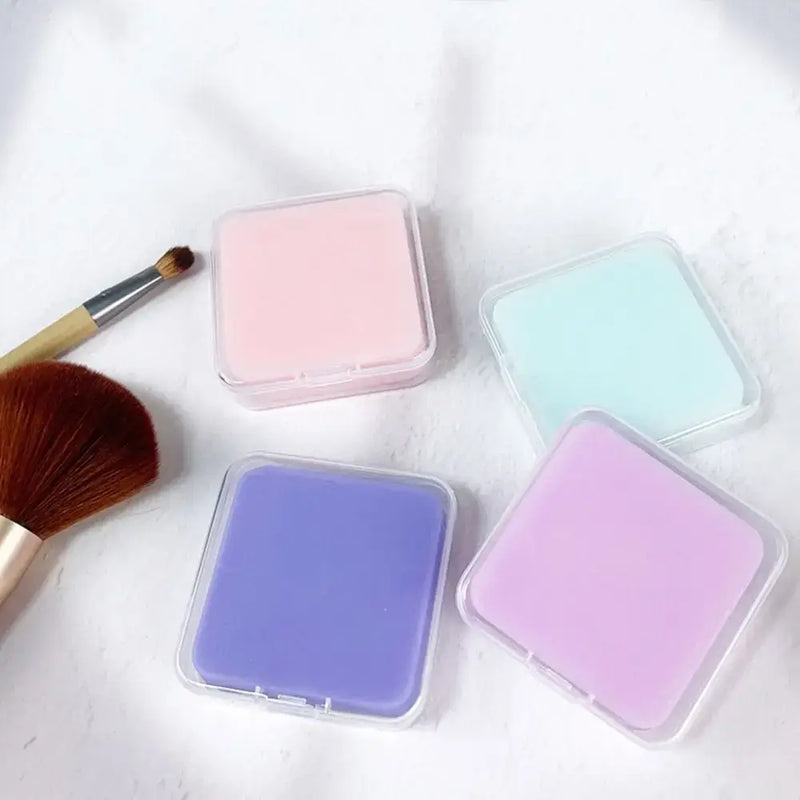 Colorful 50g makeup brush cleaner soap in storage boxes with a makeup brush for effective cleaning.