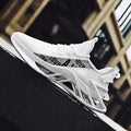 Men's breathable white sneakers with mixed color design, perfect for casual and running activities.