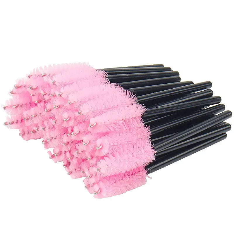 50 pcs of pink disposable mini eyelash brushes with black handles for makeup application and lash extension.