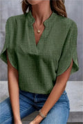 Casual women's blouse in green cotton linen, featuring V-neck and stylish short sleeves, perfect for summer outings.